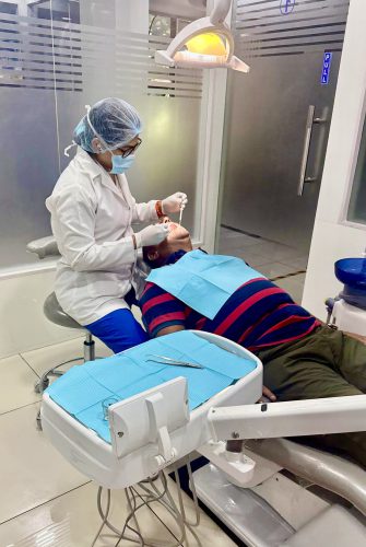 Dr Sapna treating patient